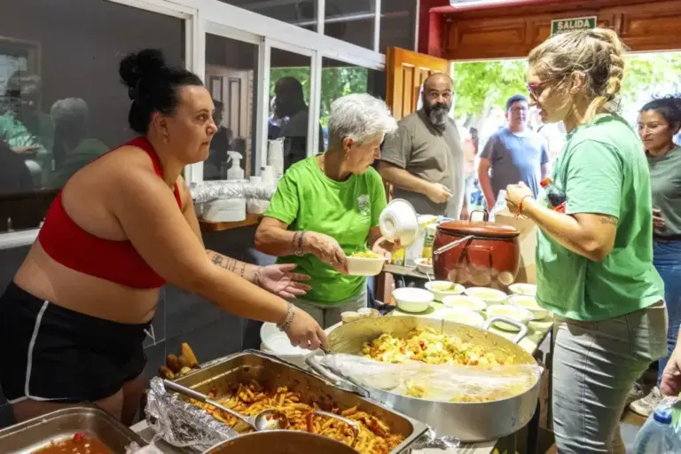 The community cooks and distributes food among those affected.