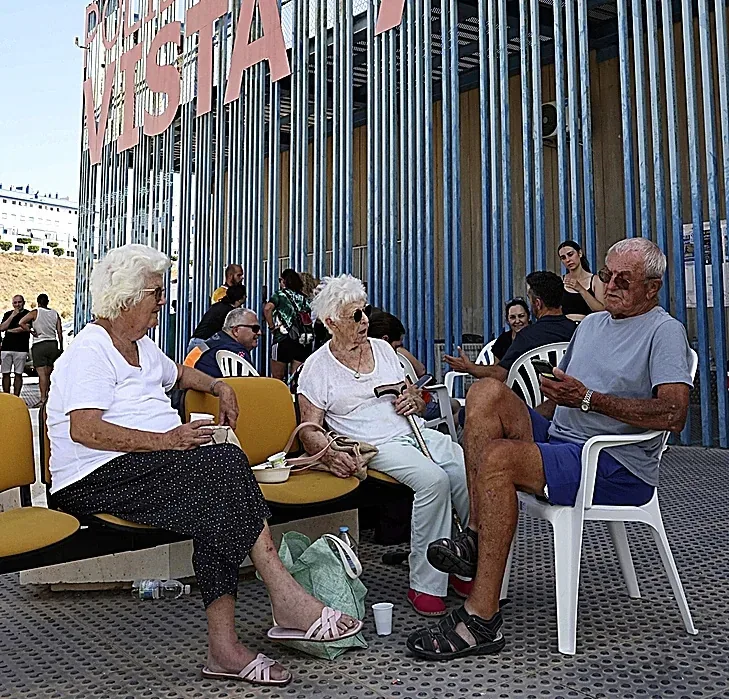 Retirees in the sports center that hosted the evacuees