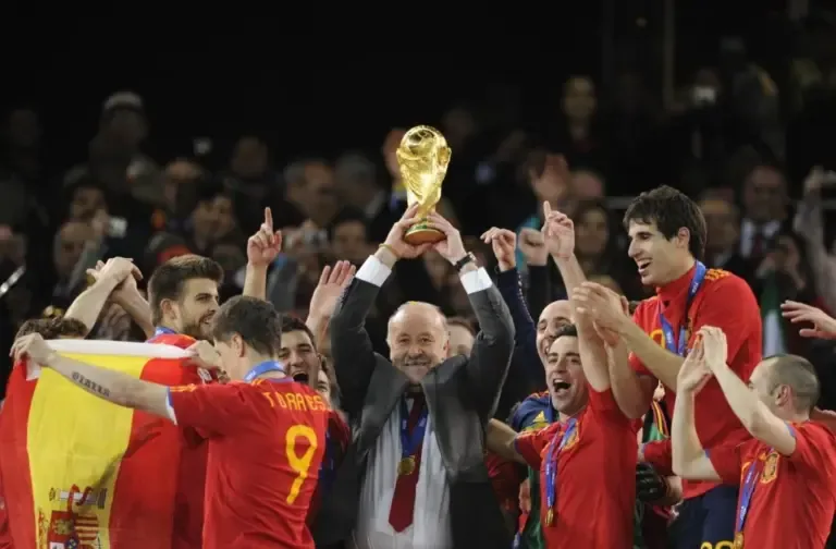 Vicente del Bosque lifts the World Cup in Johannesburg.