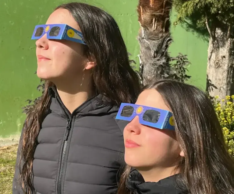 Girls safely looking at the sun