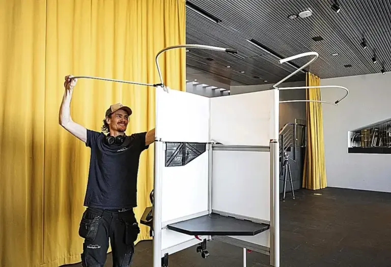A worker installs a voting booth at the City Hall of the Icelandic capital.