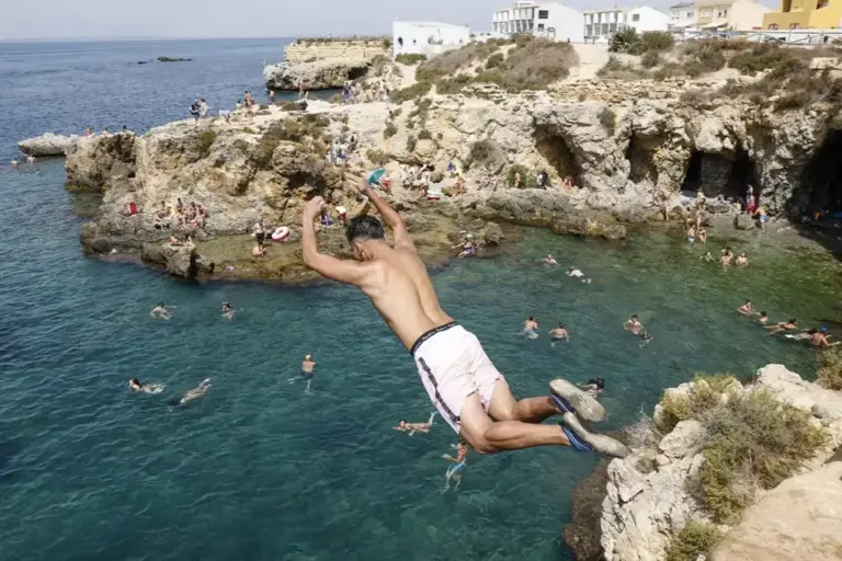 Even the cliffs of this island are full of people