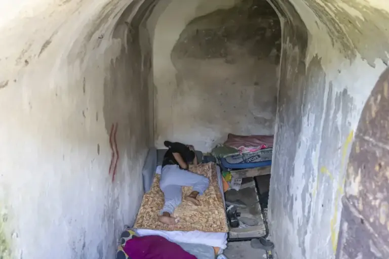 The pipe where they sleep during the day, where their belongings pile up.