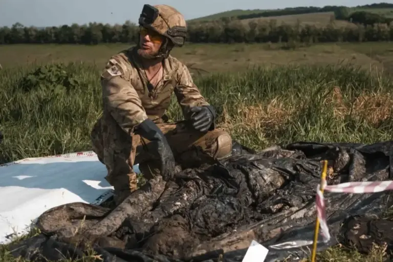 Yukov, next to the lifeless body of a Russian soldier.
