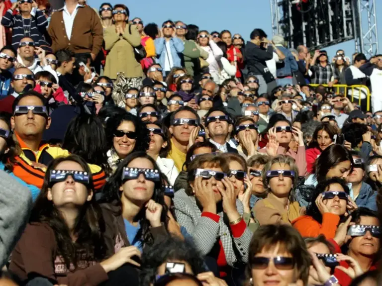 Hundreds of people with special sunglasses gathered to watch a solar eclipse.