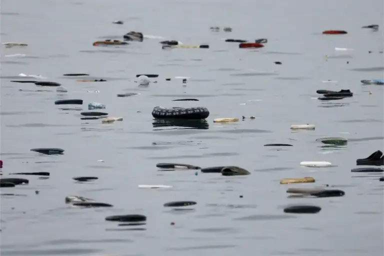 A floater stands out among the footwear lost by dozens of migrants who swam across El Tarajal beach to cross from Morocco to Ceuta.