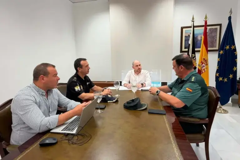 Triano (center) and Sanz (first on the left) in a meeting in Ceuta.